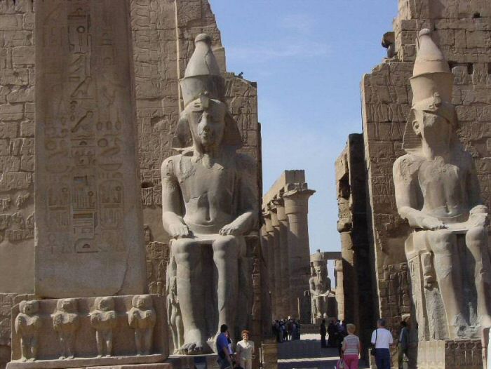 Luxor - Base of the obelisk and statues of Ramses II at the entrance of the temple